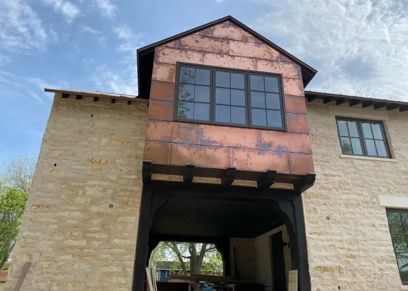 Copper metal panel facade on a stone building for Skylight Installation in East Rockhill